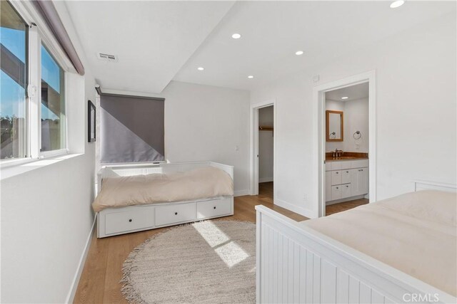 390 Saint Anns Dr, Laguna Beach, CA 92651 - bedroom with wood finished floors, recessed lighting, and connected bathroom
