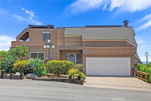 390 Saint Anns Dr, Laguna Beach, CA 92651 - view of front of home with decorative driveway and roof with shingles