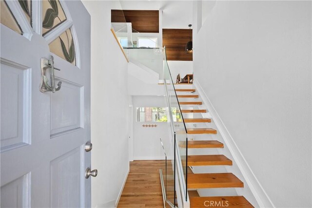 390 Saint Anns Dr, Laguna Beach, CA 92651 - stairway with wood finished floors and a high ceiling