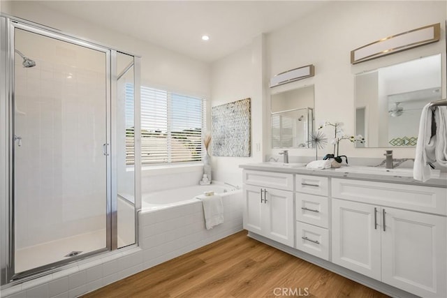 17 Marseille Way, Lake Forest, CA 92610 - full bathroom with a stall shower, a bath, double vanity, wood finished floors, and recessed lighting