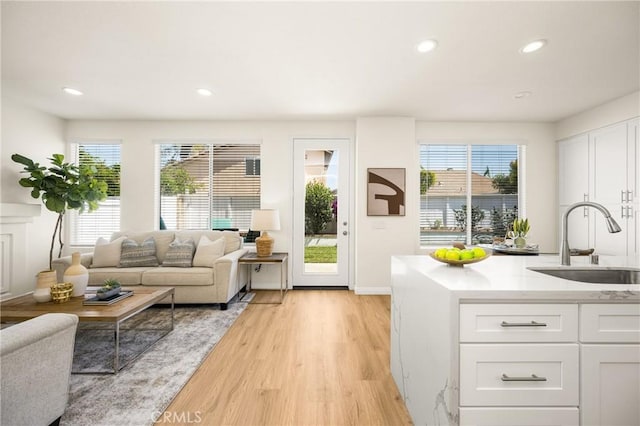 17 Marseille Way, Lake Forest, CA 92610 - living room featuring healthy amount of natural light, light wood finished floors, and recessed lighting