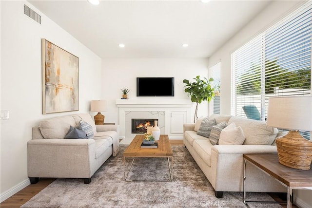 17 Marseille Way, Lake Forest, CA 92610 - living area with wood finished floors, a high end fireplace, and recessed lighting