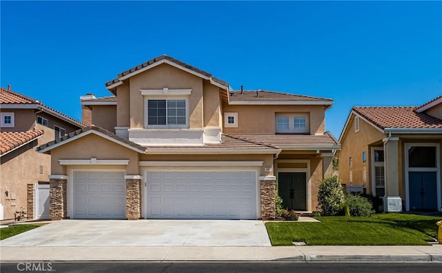 17 Marseille Way, Lake Forest, CA 92610 - view of front of house with stucco siding, a garage, concrete driveway, a front yard, and stone siding