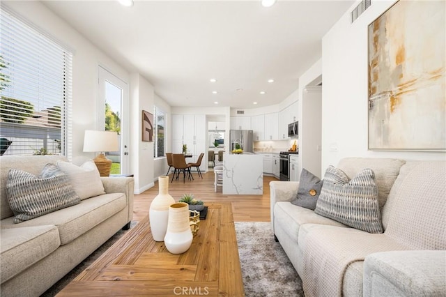17 Marseille Way, Lake Forest, CA 92610 - living room featuring recessed lighting and light wood-type flooring