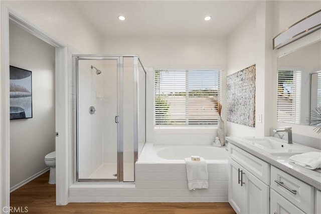 17 Marseille Way, Lake Forest, CA 92610 - full bathroom with double vanity, a stall shower, a bath, wood finished floors, and recessed lighting