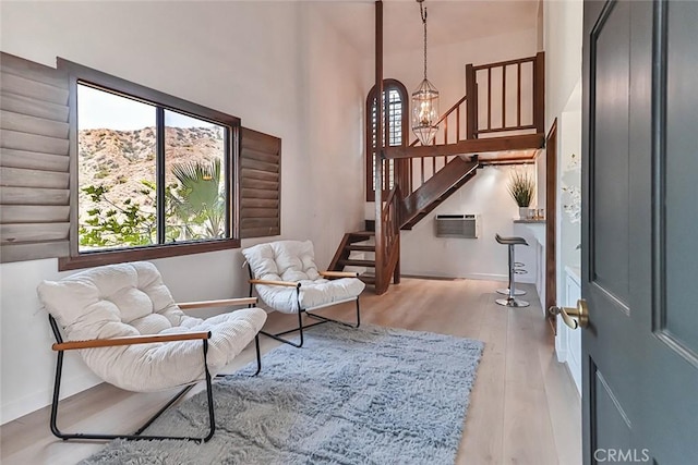 1369 Paseo Redondo, Burbank, CA 91501 - sitting room featuring a chandelier, stairs, wood finished floors, and a wall mounted AC