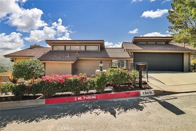 1369 Paseo Redondo, Burbank, CA 91501 - view of front facade featuring a tiled roof, driveway, and an attached garage
