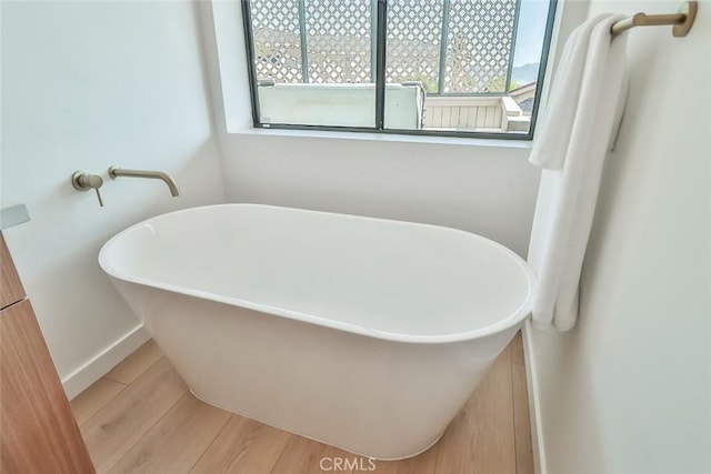 1369 Paseo Redondo, Burbank, CA 91501 - bathroom featuring plenty of natural light, a freestanding tub, and wood finished floors