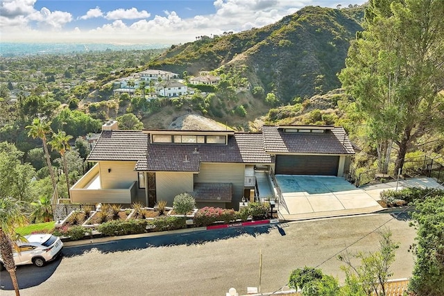 1369 Paseo Redondo, Burbank, CA 91501 - view of front facade with driveway, a mountain view, a tile roof, and an attached garage