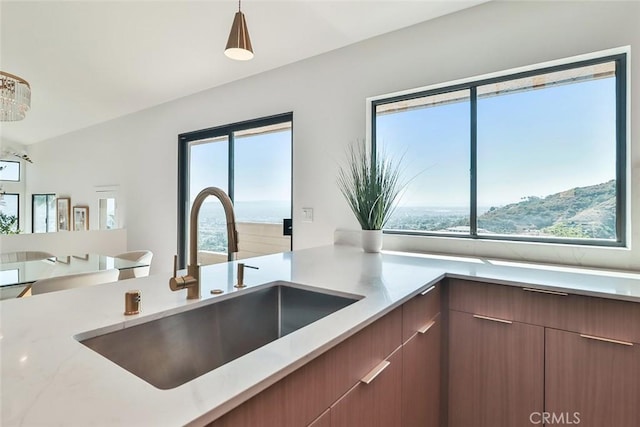 1369 Paseo Redondo, Burbank, CA 91501 - kitchen with pendant lighting, open floor plan, light stone counters, and modern cabinets
