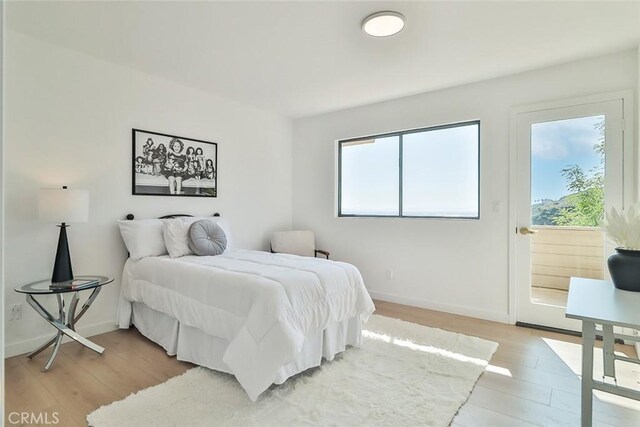 1369 Paseo Redondo, Burbank, CA 91501 - bedroom featuring light wood-style flooring, multiple windows, and access to outside