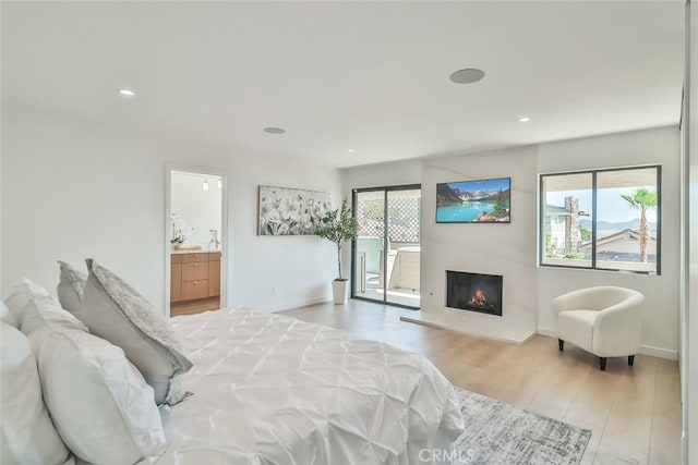 1369 Paseo Redondo, Burbank, CA 91501 - bedroom featuring light wood-type flooring, a lit fireplace, recessed lighting, and ensuite bath