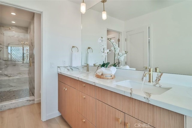 1369 Paseo Redondo, Burbank, CA 91501 - full bathroom featuring double vanity, a marble finish shower, and wood finished floors