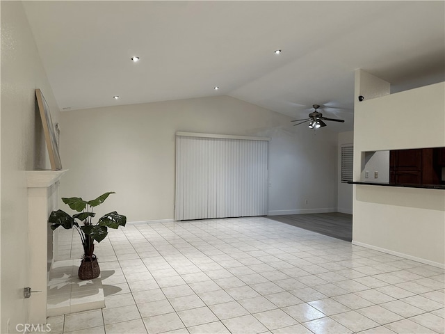 1350 William Mcgrath St, Colton, CA 92324 - unfurnished living room featuring light tile patterned floors, vaulted ceiling, and ceiling fan