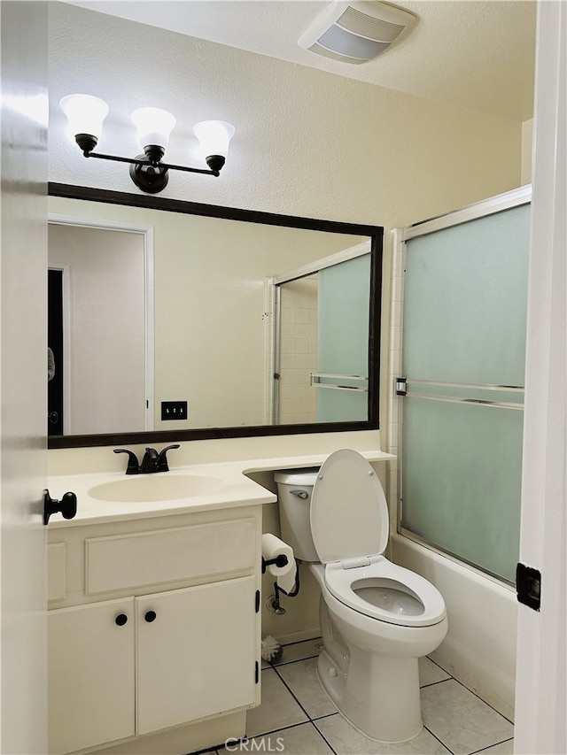 1350 William Mcgrath St, Colton, CA 92324 - full bath featuring tile patterned flooring, vanity, and bath / shower combo with glass door