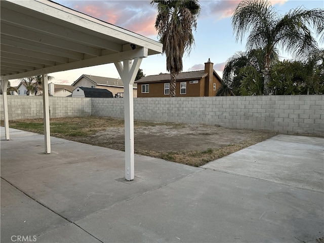 1350 William Mcgrath St, Colton, CA 92324 - patio terrace at dusk with a patio and a fenced backyard