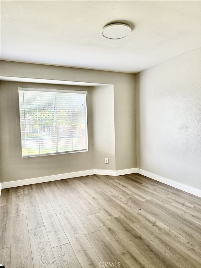 1350 William Mcgrath St, Colton, CA 92324 - empty room featuring wood finished floors and baseboards