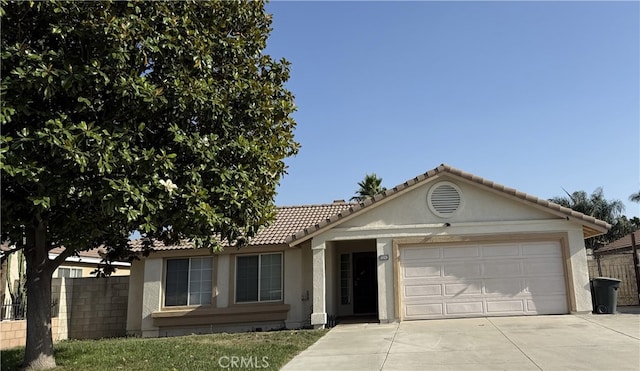 1350 William Mcgrath St, Colton, CA 92324 - single story home featuring driveway, a garage, stucco siding, and a tile roof