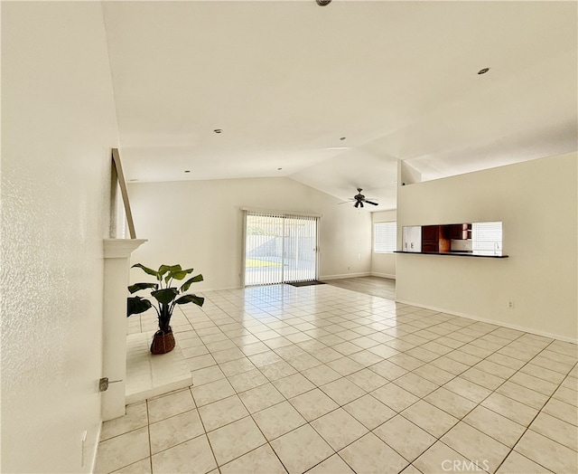 1350 William Mcgrath St, Colton, CA 92324 - unfurnished living room featuring lofted ceiling, light tile patterned floors, and ceiling fan