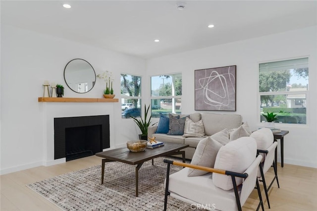 200 N Alberta Pl, Fullerton, CA 92833 - living room featuring plenty of natural light, recessed lighting, a fireplace with flush hearth, and light wood-style flooring