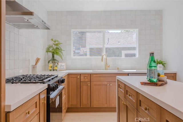 200 N Alberta Pl, Fullerton, CA 92833 - kitchen featuring gas stove, wall chimney range hood, backsplash, and light countertops