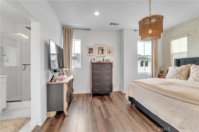 516 Caleigh Ln, Costa Mesa, CA 92627 - bedroom featuring wood finished floors and ensuite bath