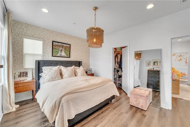 516 Caleigh Ln, Costa Mesa, CA 92627 - bedroom with wallpapered walls, wood finished floors, a closet, a walk in closet, and recessed lighting