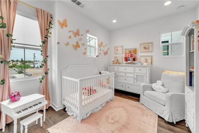 516 Caleigh Ln, Costa Mesa, CA 92627 - bedroom with wood finished floors, a crib, and recessed lighting
