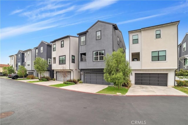 516 Caleigh Ln, Costa Mesa, CA 92627 - multi unit property with a residential view, stucco siding, an attached garage, and concrete driveway