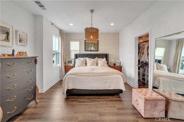 516 Caleigh Ln, Costa Mesa, CA 92627 - bedroom featuring multiple windows, wood finished floors, recessed lighting, and a spacious closet