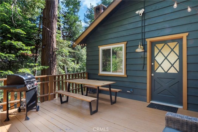 698 W Victoria Ct, Lake Arrowhead, CA 92352 - wooden deck featuring grilling area and outdoor dining space