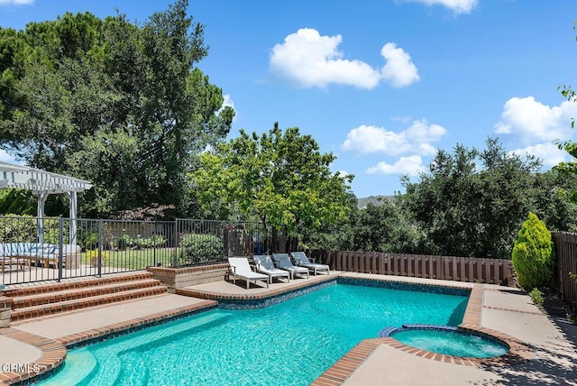 18845 Braemore Rd, Porter Ranch, CA 91326 - view of swimming pool featuring a patio, a fenced backyard, and a pool with connected hot tub