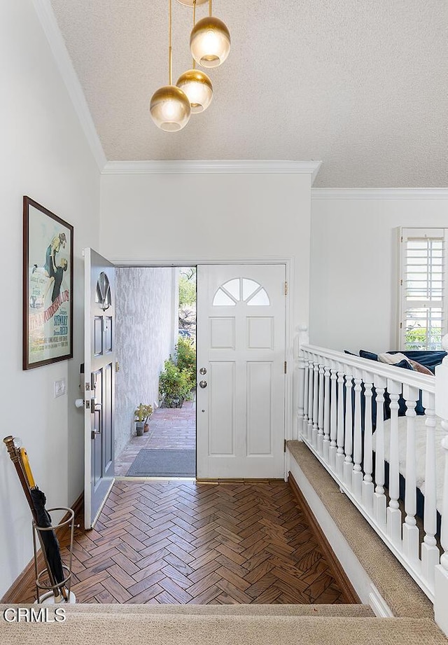 18845 Braemore Rd, Porter Ranch, CA 91326 - entrance foyer with ornamental molding, healthy amount of natural light, and a textured ceiling