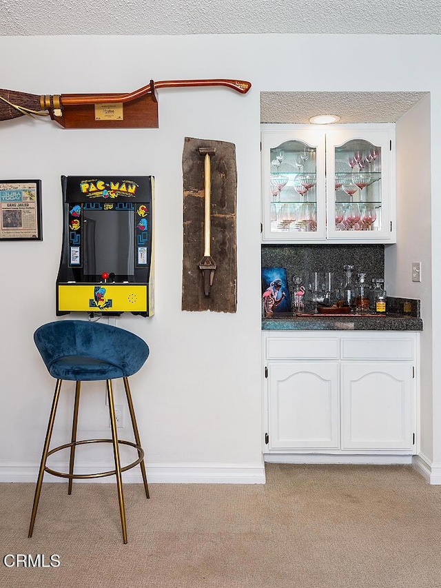18845 Braemore Rd, Porter Ranch, CA 91326 - indoor bar featuring light carpet and baseboards