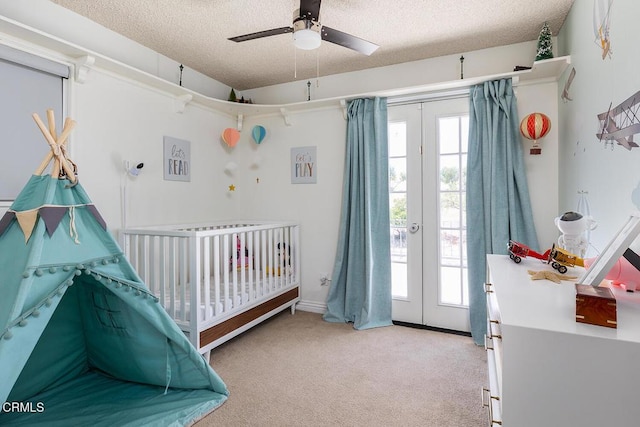 18845 Braemore Rd, Porter Ranch, CA 91326 - carpeted bedroom with french doors, a textured ceiling, and ceiling fan