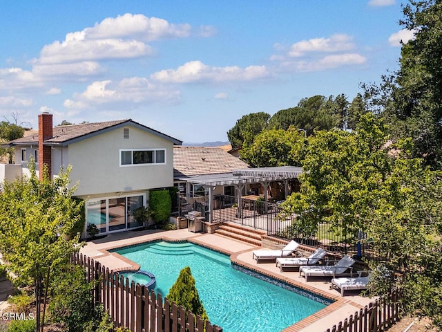 18845 Braemore Rd, Porter Ranch, CA 91326 - view of swimming pool featuring a pergola, a pool with connected hot tub, and a patio