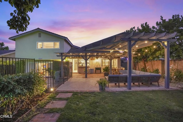 18845 Braemore Rd, Porter Ranch, CA 91326 - rear view of house with a pergola, a patio area, and stucco siding