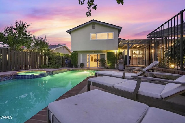 18845 Braemore Rd, Porter Ranch, CA 91326 - pool at dusk with a patio area, a pergola, and a pool with connected hot tub