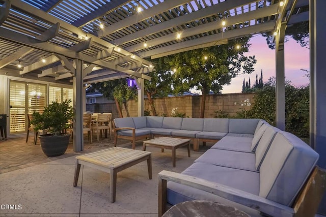 18845 Braemore Rd, Porter Ranch, CA 91326 - patio terrace at dusk featuring an outdoor living space, a fenced backyard, a pergola, a patio, and outdoor dining area