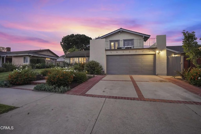 18845 Braemore Rd, Porter Ranch, CA 91326 - traditional-style house with a balcony, concrete driveway, and stucco siding
