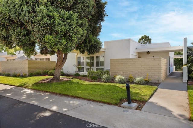 2179 Via Puerta Unit R, Laguna Woods, CA 92637 - view of front of property with stucco siding