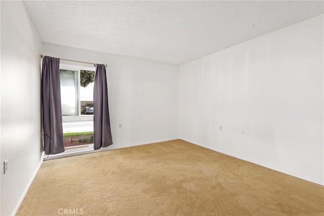 2179 Via Puerta Unit R, Laguna Woods, CA 92637 - carpeted spare room featuring baseboards and a textured ceiling