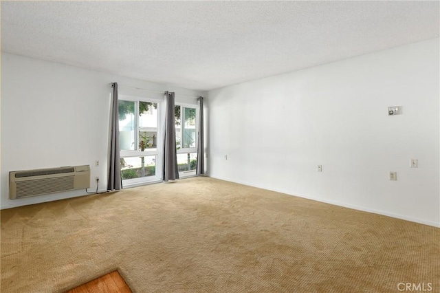 2179 Via Puerta Unit R, Laguna Woods, CA 92637 - carpeted empty room featuring an AC wall unit
