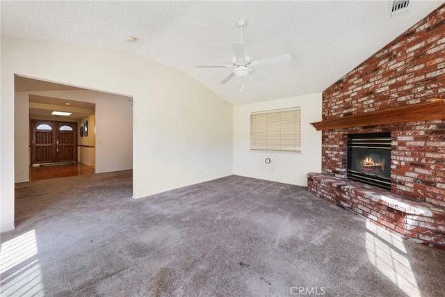 35632 Avocado St, Yucaipa, CA 92399 - unfurnished living room with lofted ceiling, carpet flooring, ceiling fan, and a brick fireplace