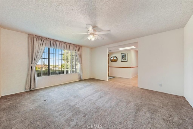 35632 Avocado St, Yucaipa, CA 92399 - spare room with carpet floors, a ceiling fan, and a textured ceiling
