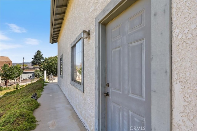 35632 Avocado St, Yucaipa, CA 92399 - doorway to property featuring stucco siding