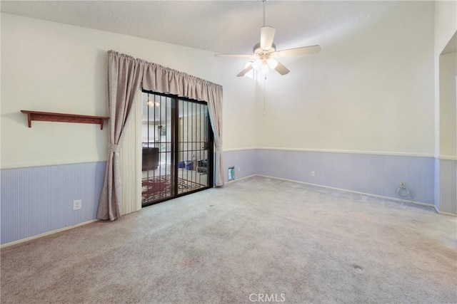 35632 Avocado St, Yucaipa, CA 92399 - unfurnished room with a ceiling fan, carpet floors, and wainscoting