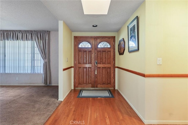 35632 Avocado St, Yucaipa, CA 92399 - entryway with plenty of natural light, wood finished floors, and a textured ceiling