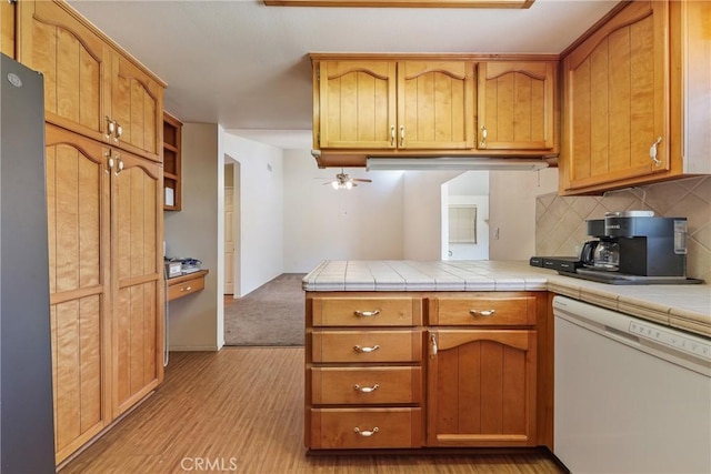 35632 Avocado St, Yucaipa, CA 92399 - kitchen with dishwasher, freestanding refrigerator, a peninsula, decorative backsplash, and light wood finished floors