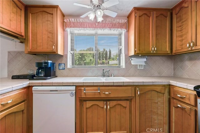 35632 Avocado St, Yucaipa, CA 92399 - kitchen featuring white dishwasher, ceiling fan, decorative backsplash, and light countertops